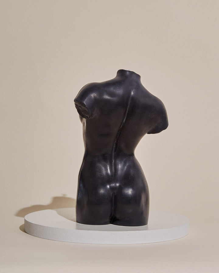 black female body sculpture candle