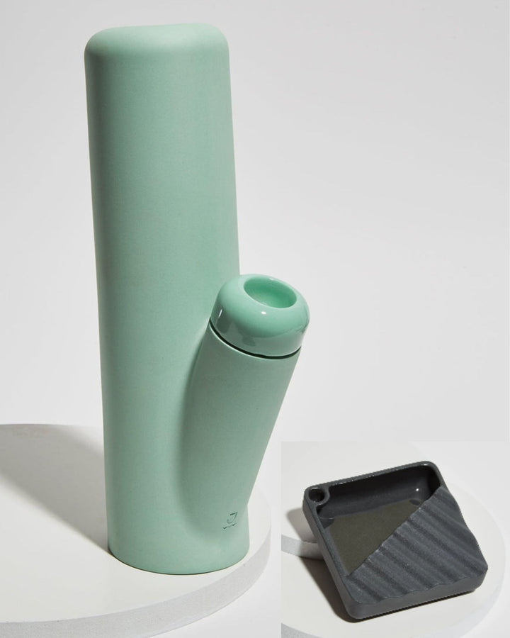 Jaunt bough ceramic bong in mint green with black ripple ashtray.