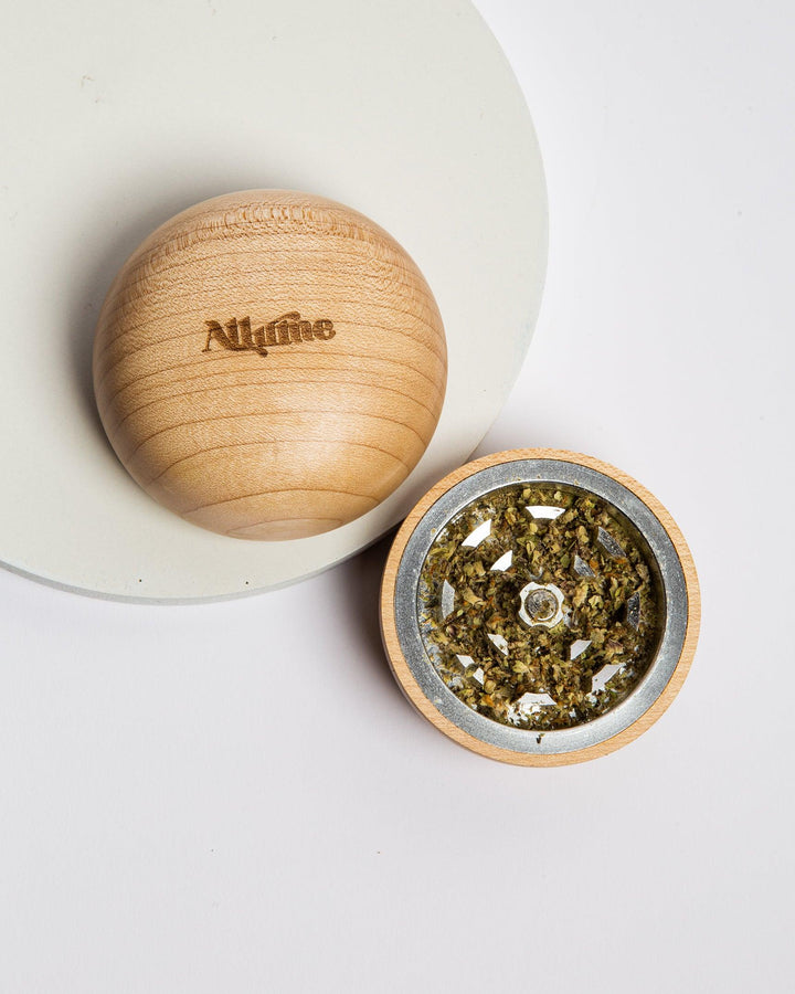 open allume shroomie grinder with fluffy weed