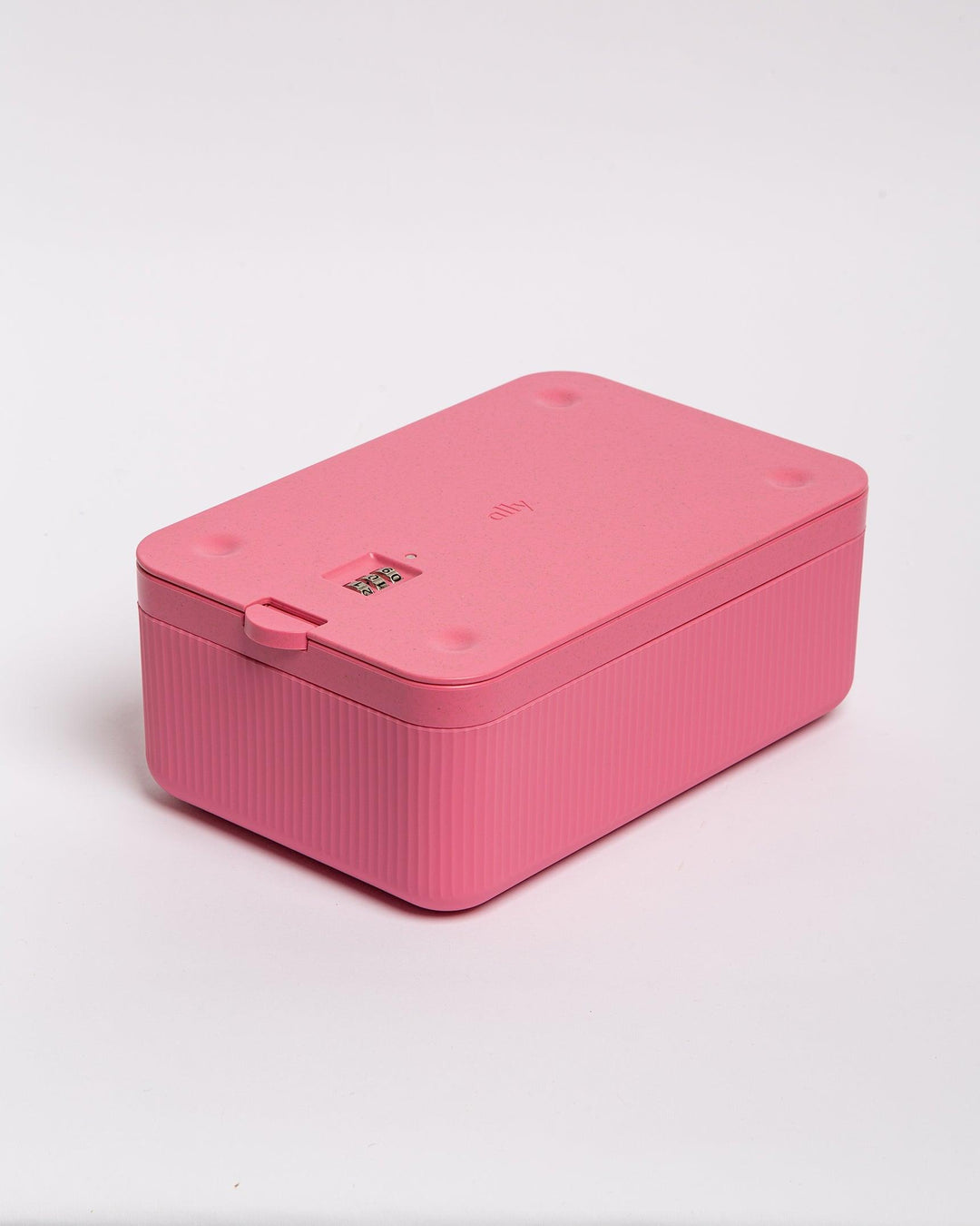 Closed pink stash box with secure combination lock.