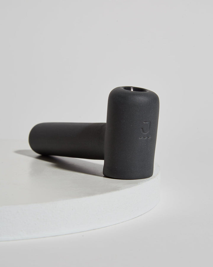 Luxury designer sleek black dry herb pipe.
