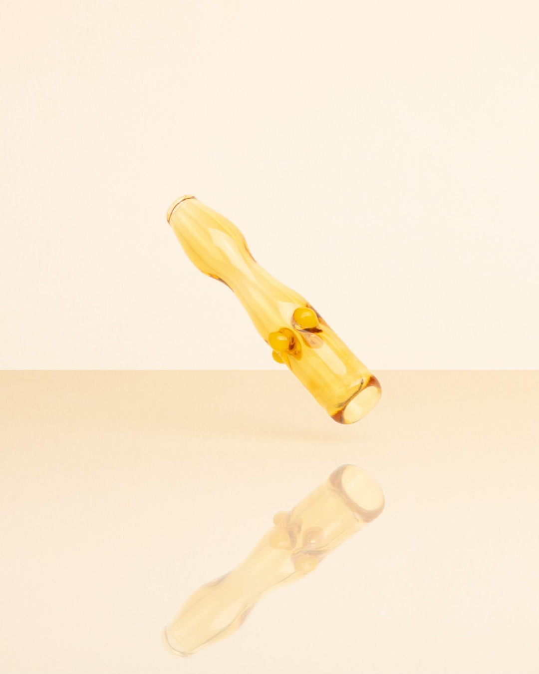 Glass Joint Holder in Marigold Yellow by House of Puff. 