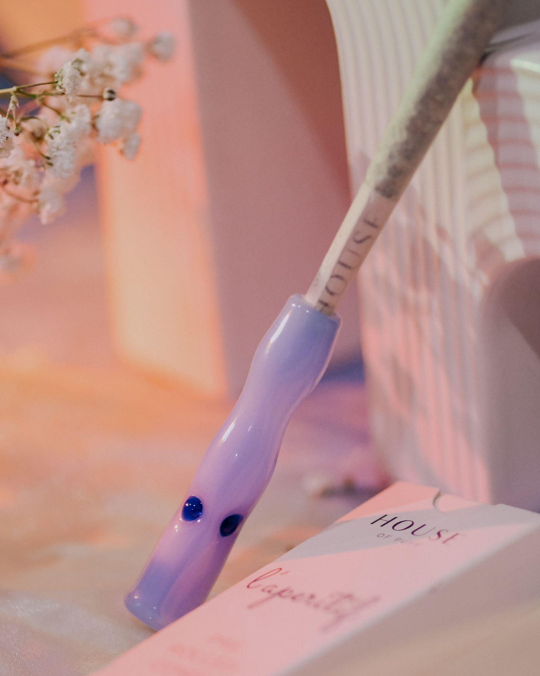 House of Puff Cigarette Holder in lavender with cannabis joint.