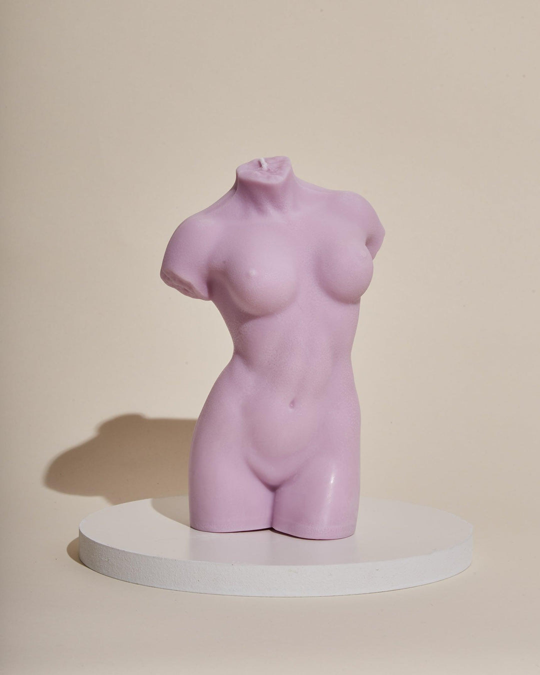 purple female body sculpture candle