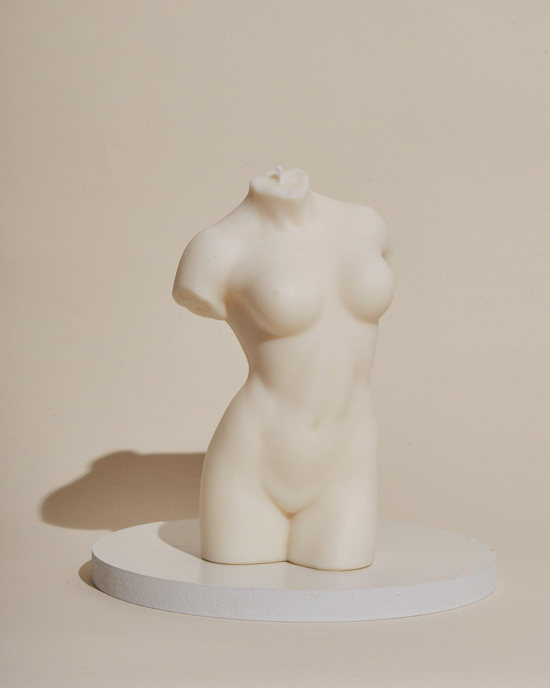 white female body sculpture candle
