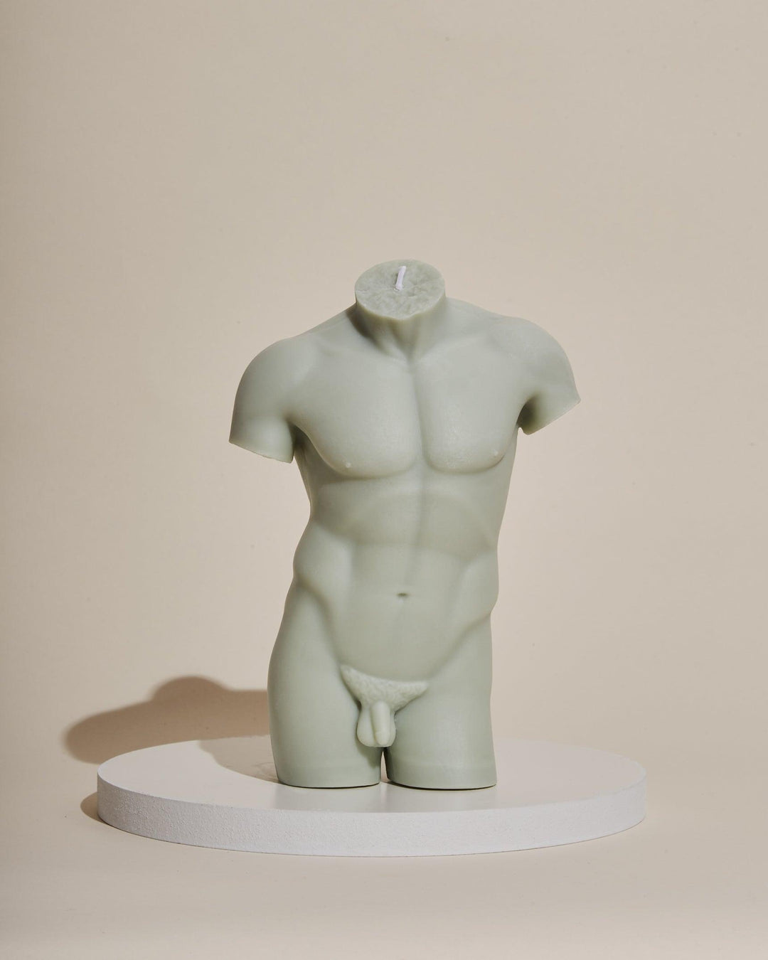 sage green male sculpture candle