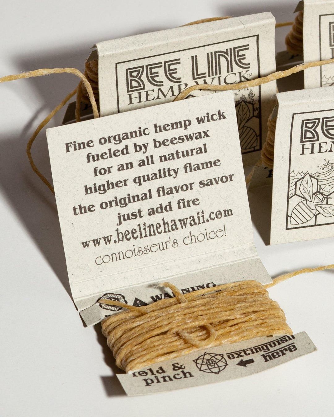 Bee Line hemp wick packages showing organic ingredient list.