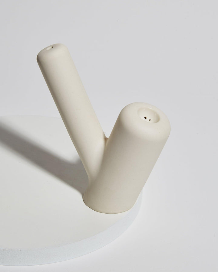 Sleek modern ceramic hand pipe in ivory.