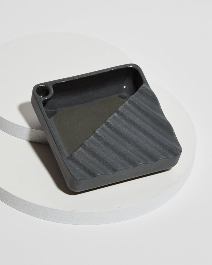 cool wavy jaunt ceramic ashtray with storage and corner snuffer in black