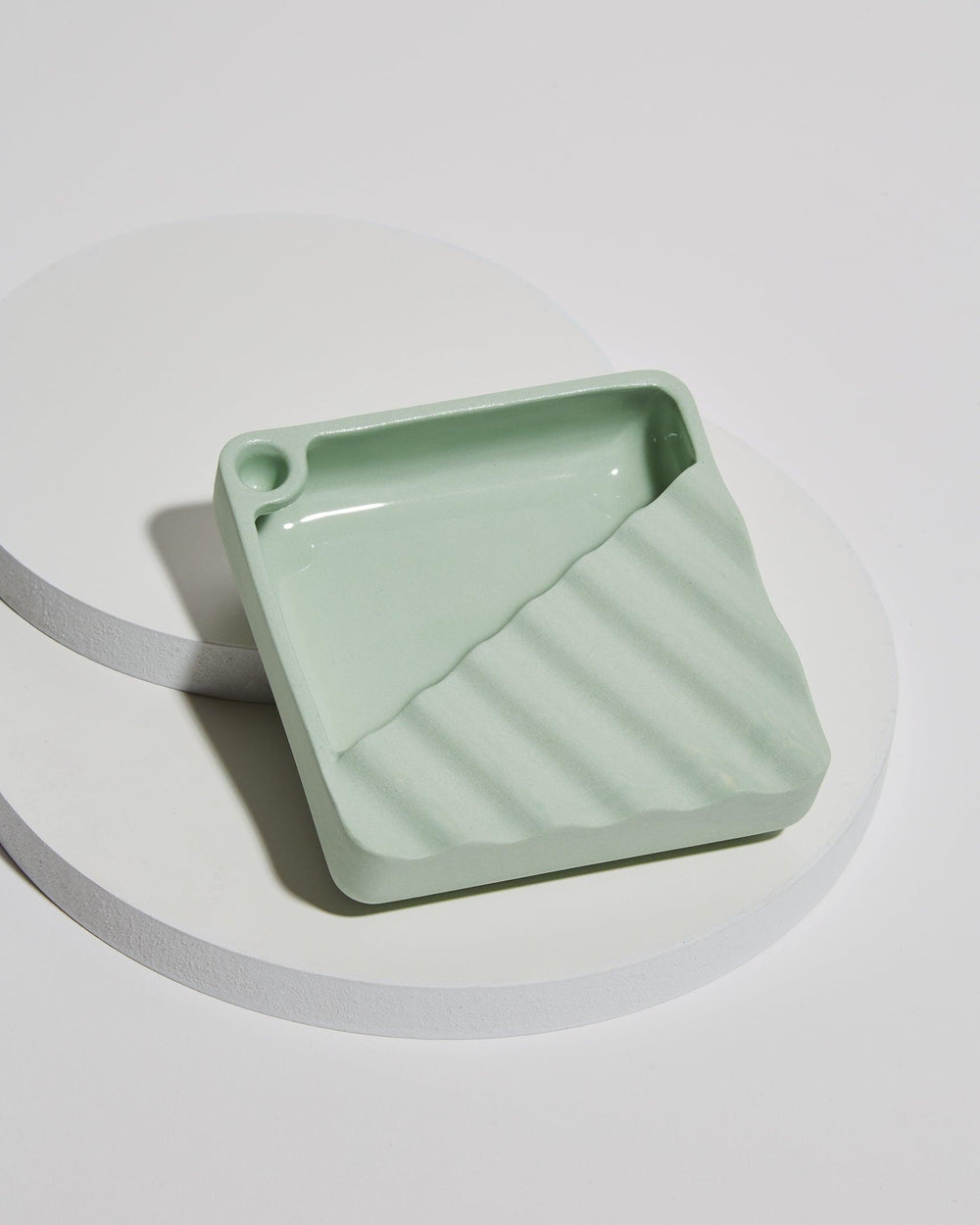 cool wavy jaunt ceramic ashtray with storage and corner snuffer in mint green