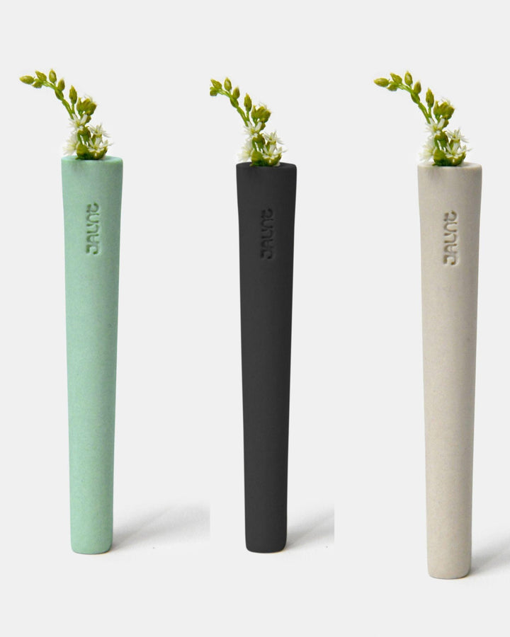 Jaunt Stem ceramic one-hitters in mint green, slate black, and ivory white.