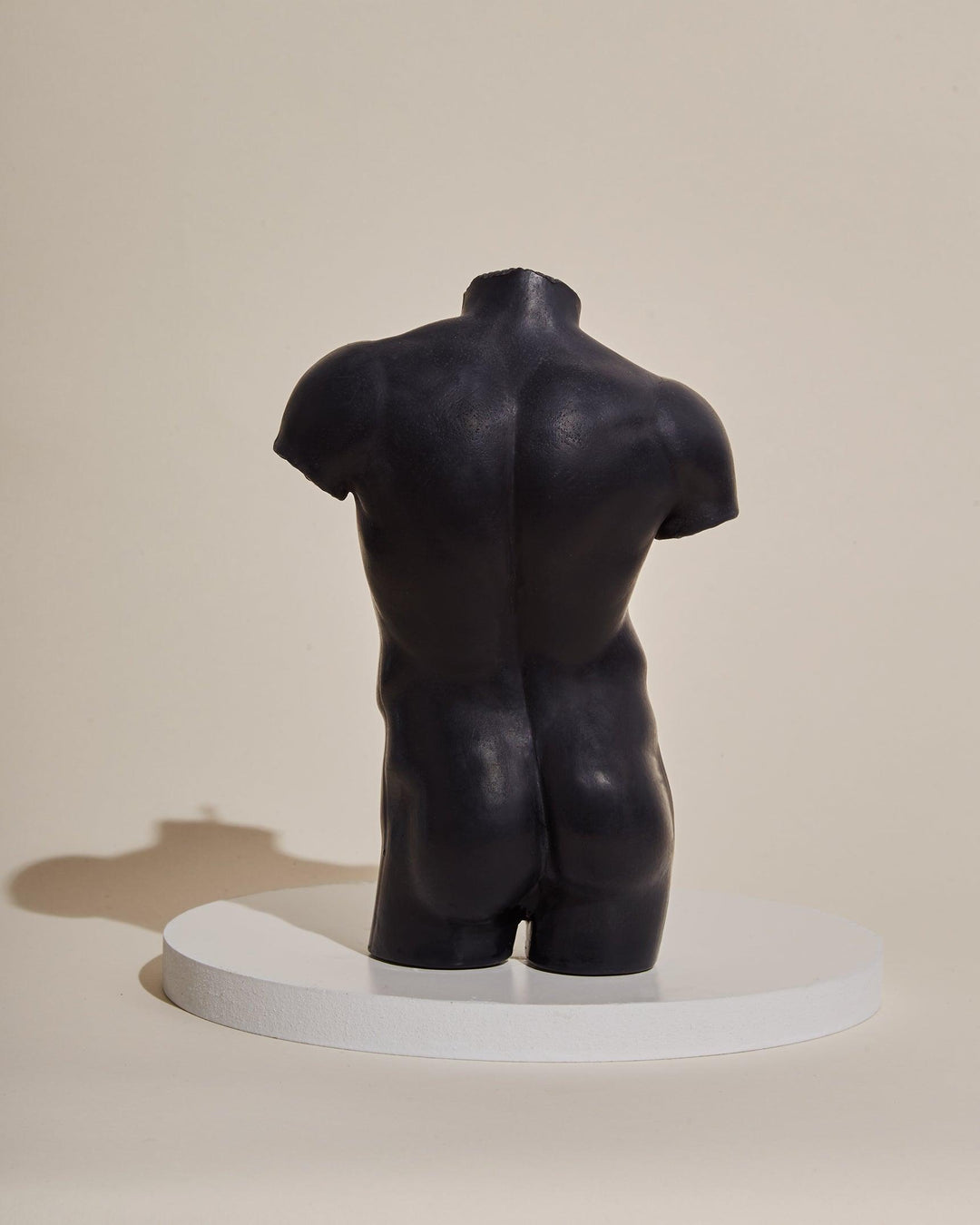 black male sculpture candle
