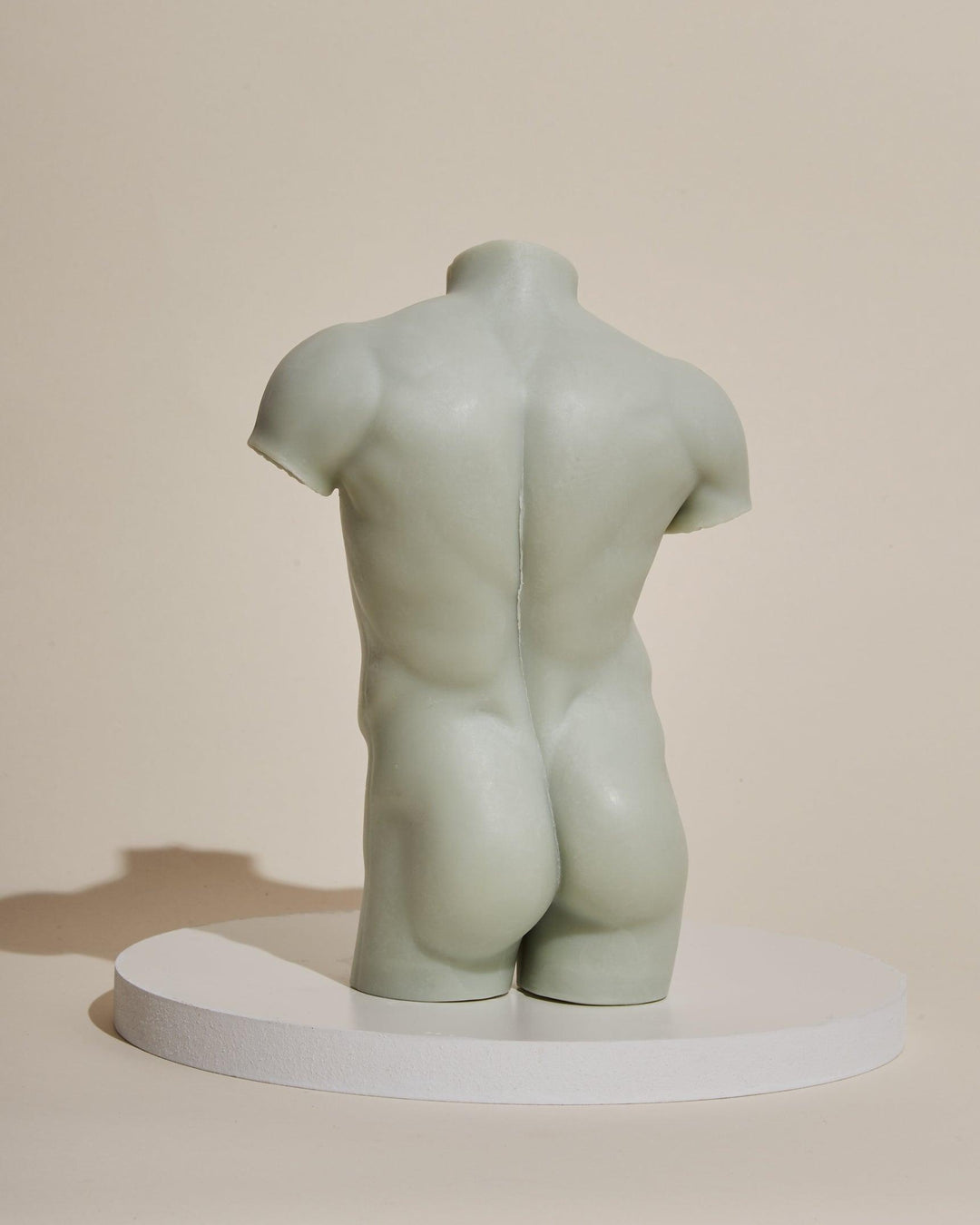 sage green male sculpture candle