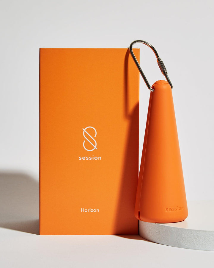session goods herb pipe with silicone sleeve and packaging in horizon orange color
